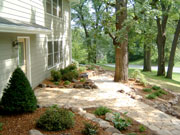 This is one of our favorites, we had to protect the mature oak trees to create this comfortable and welcoming front yard. Design by Laurie.