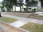 A Longfellow neighborhood homeowner did not want a plain 'ol wall, so we complimented her house with variation and gave her a new garden space to transplant her annuals to.